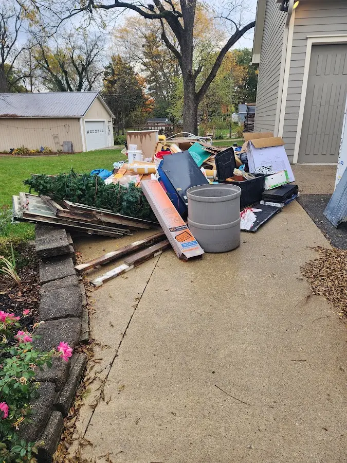 Dumpster being loaded with debris for 3 Yard Dumpster Rental in Ormond-by-the-Sea